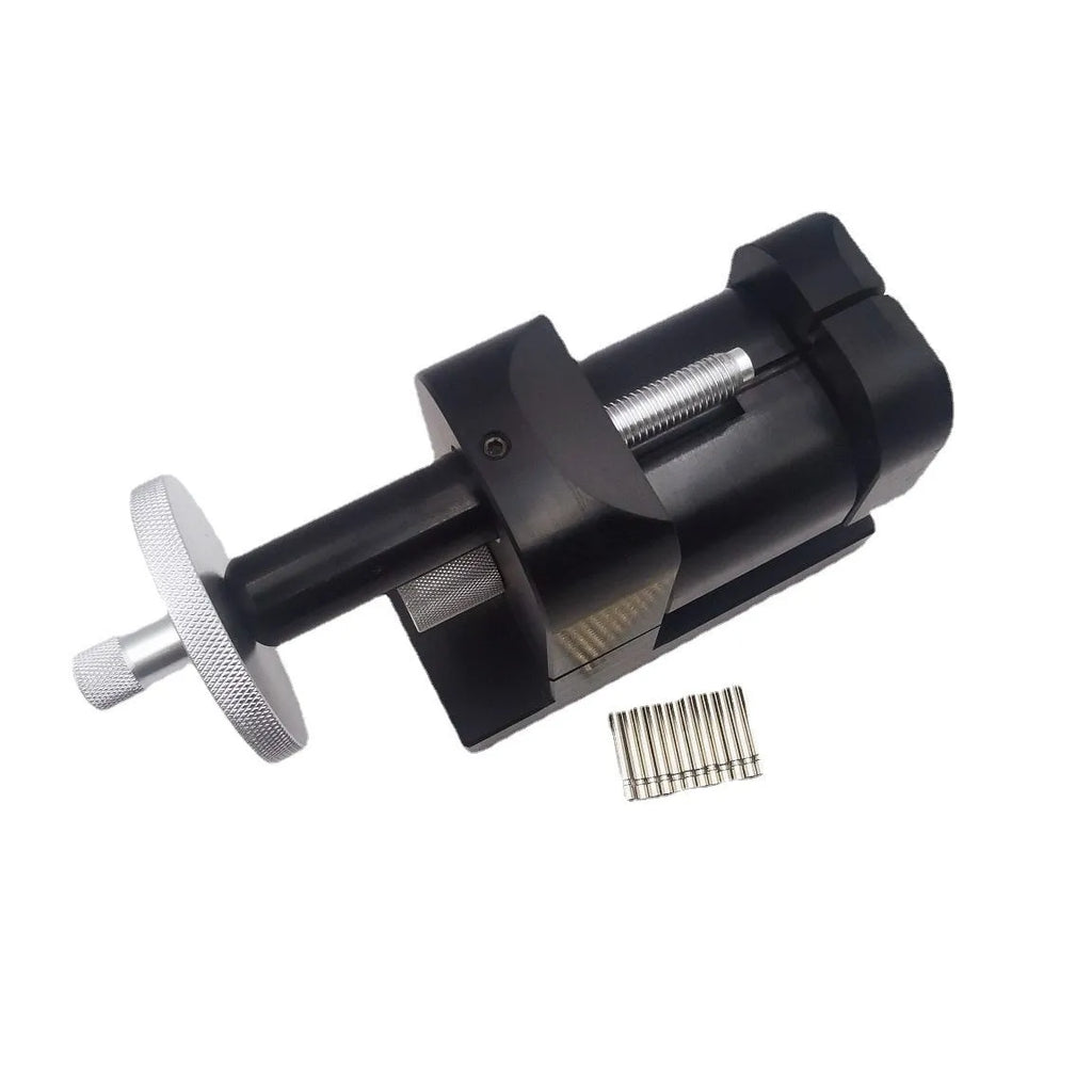 Alloy steel watch strap removal machine with accessory tools for professional watch repair.