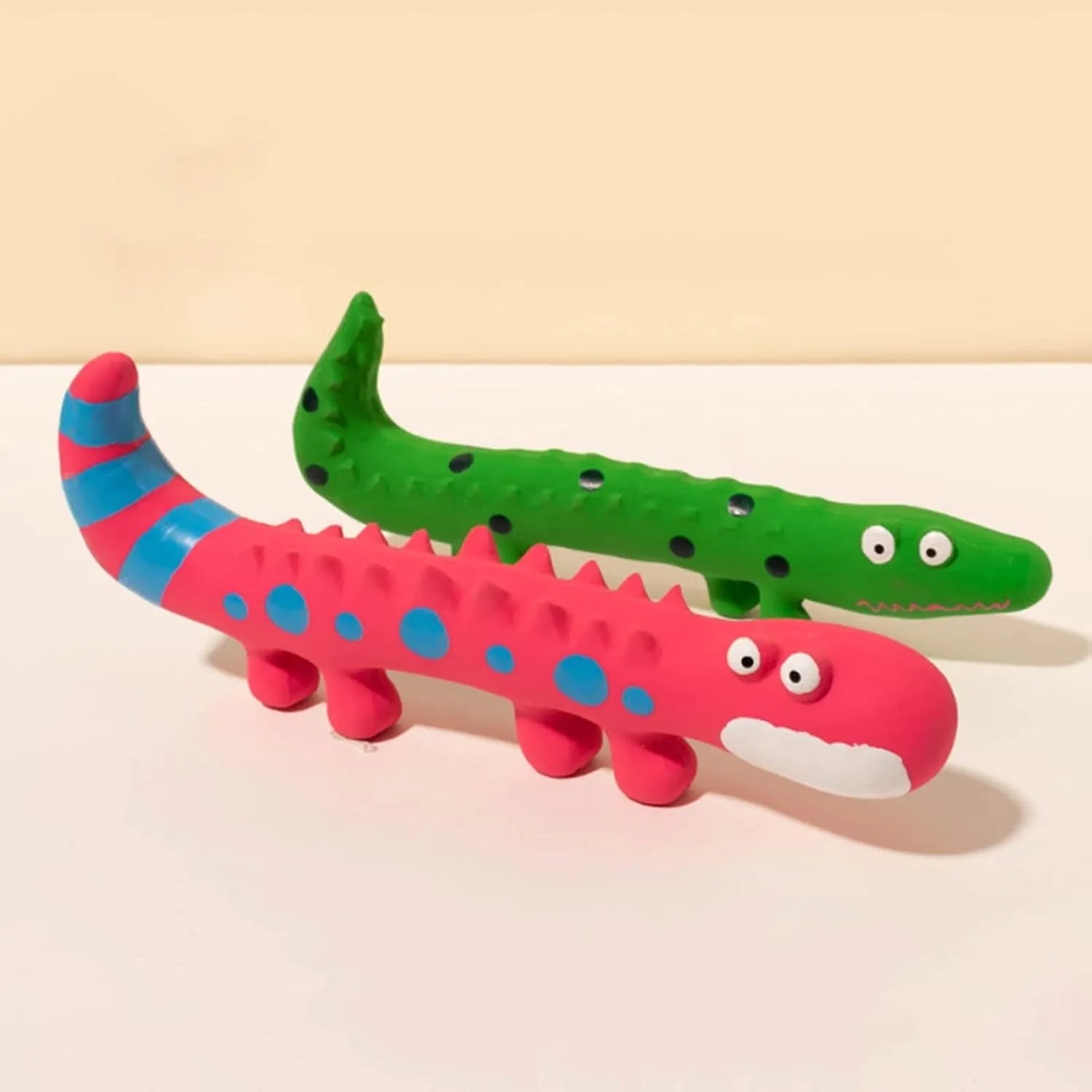 Green cartoon lizard-shaped dog chew toy with textured surface for dental cleaning