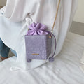Small Korean-style women's messenger bag with chain strap in various plain colours.