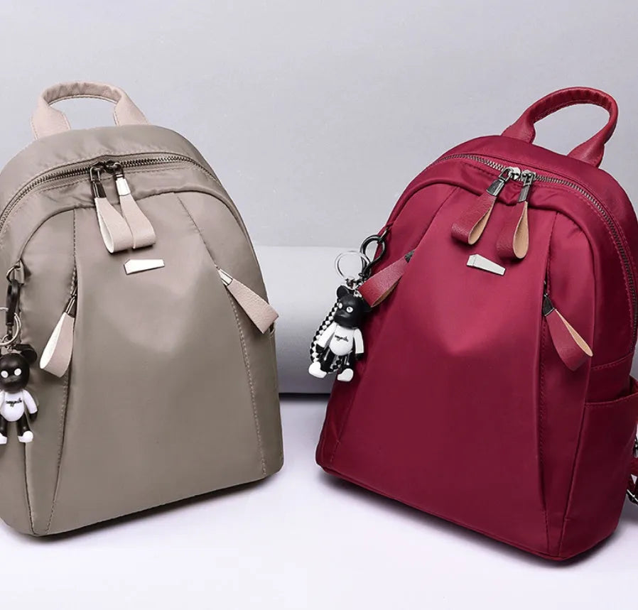 Medium Oxford cloth backpack in grey colour showing interior organisation pockets