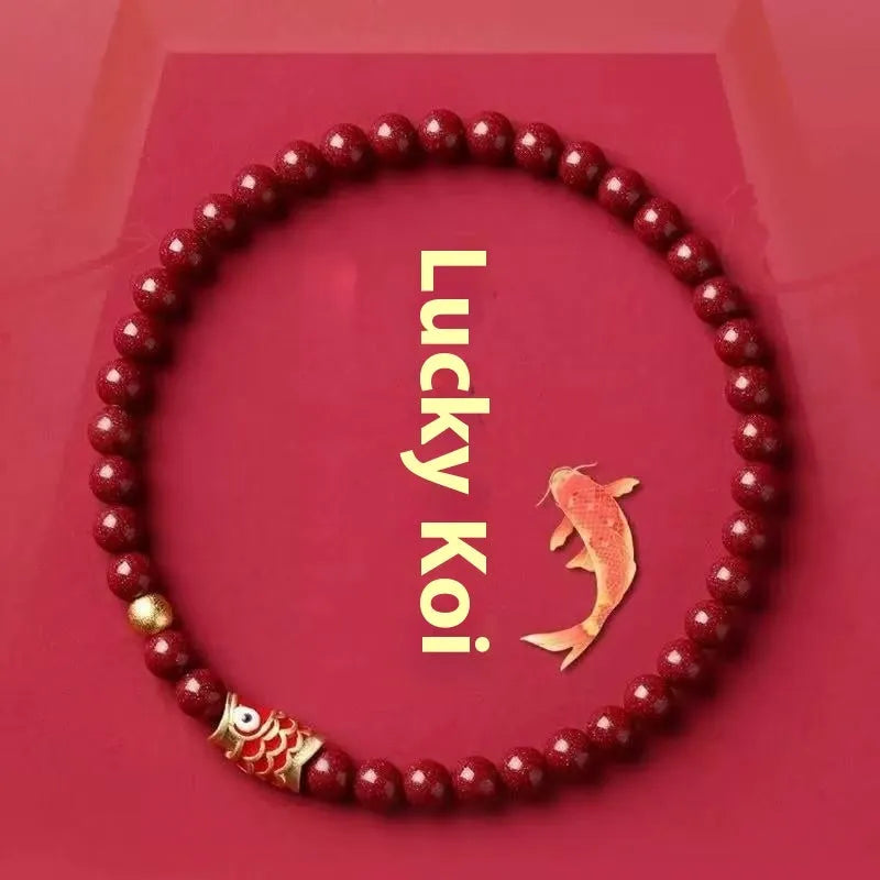 Natural cinnabar koi bracelet with golden balls in national style, showing sand grain texture
