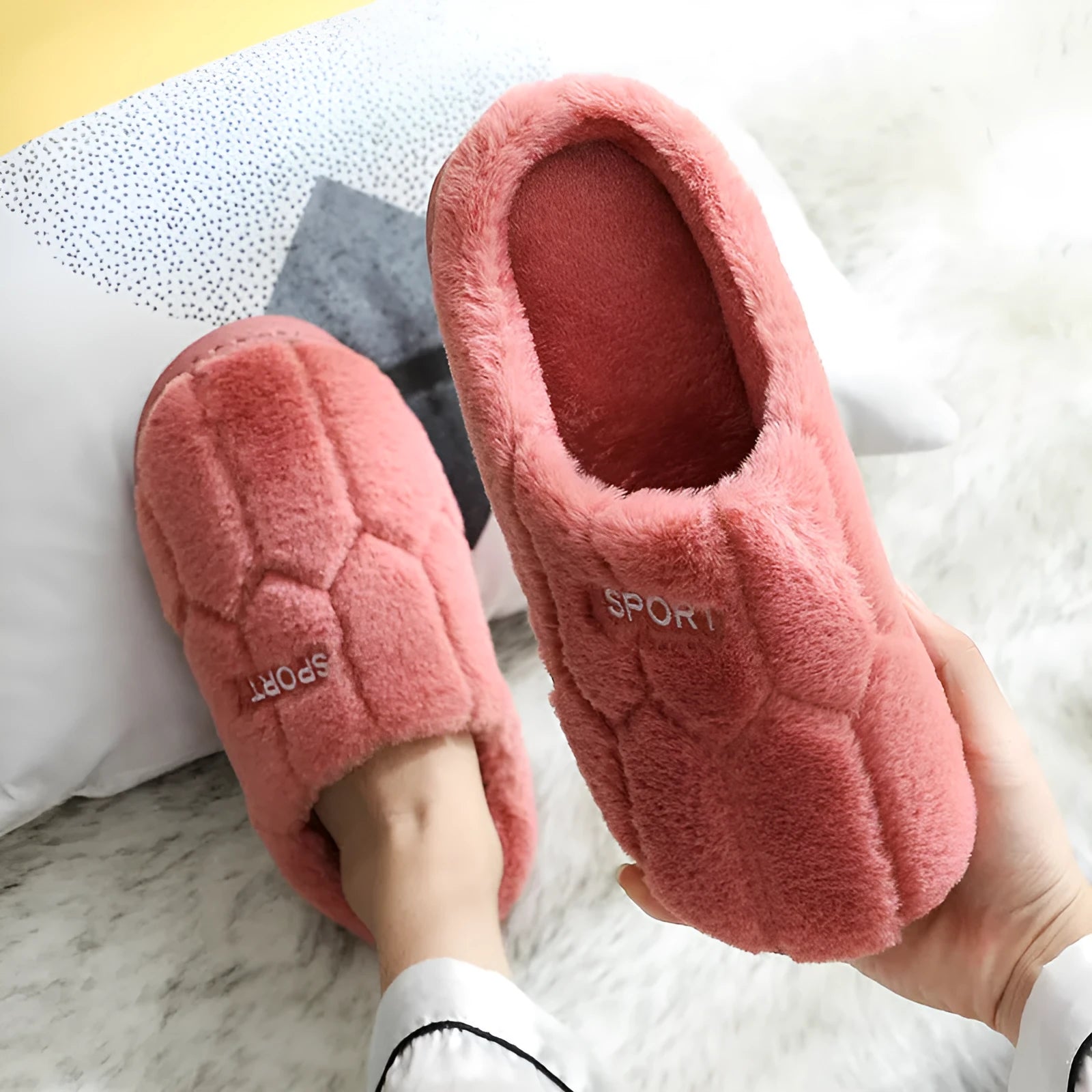Unisex plush house slippers with white honeycomb-patterned PVC sole, showing round toe and plush inner lining in purple colour
