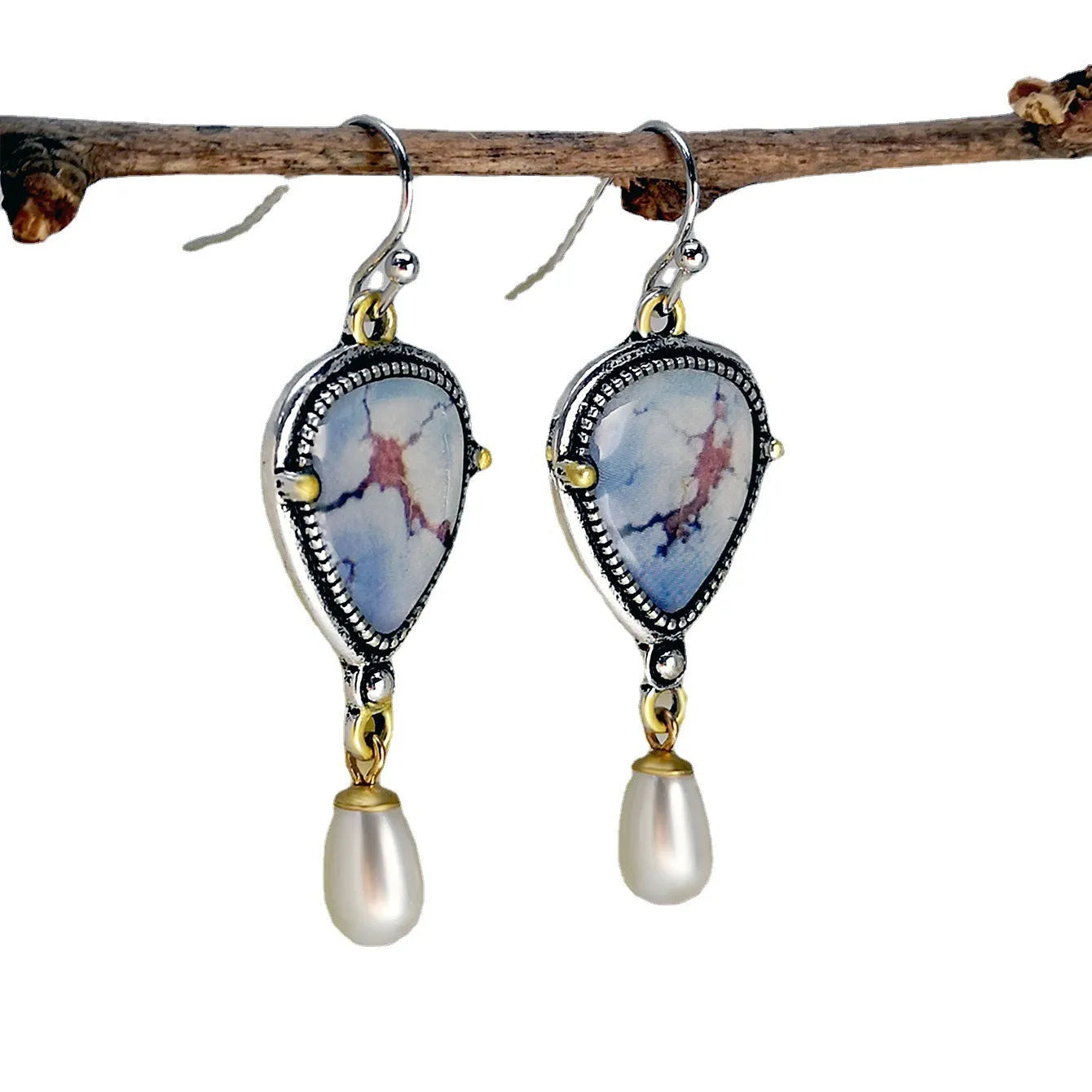 Blue retro bohemian drop earrings with synthetic opal and pearl details on electroplated metal