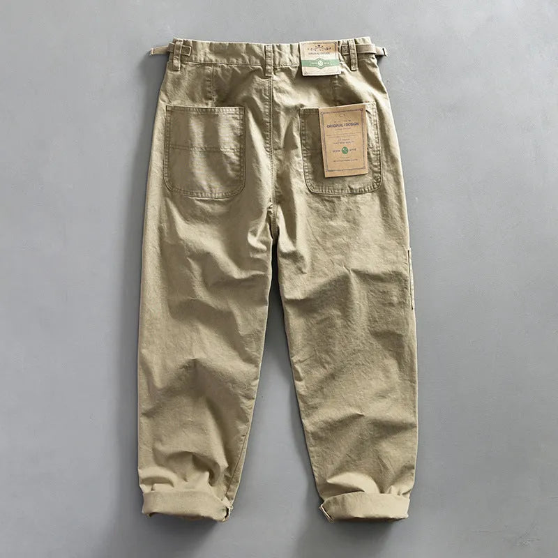 Men's straight leg cotton casual trousers in apricot, shown from the front.