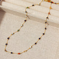 Gold titanium steel necklace with a natural stone pendant on an O-ring chain.