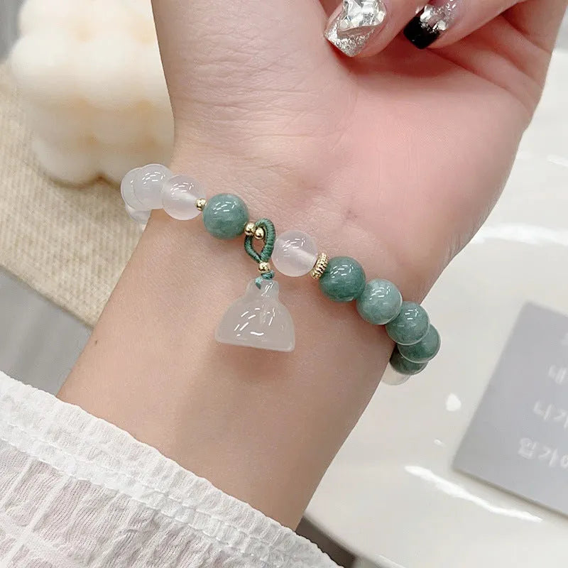 Women's retro Chinese style agate lotus seedpod bracelet with Burma jade accents on wrist