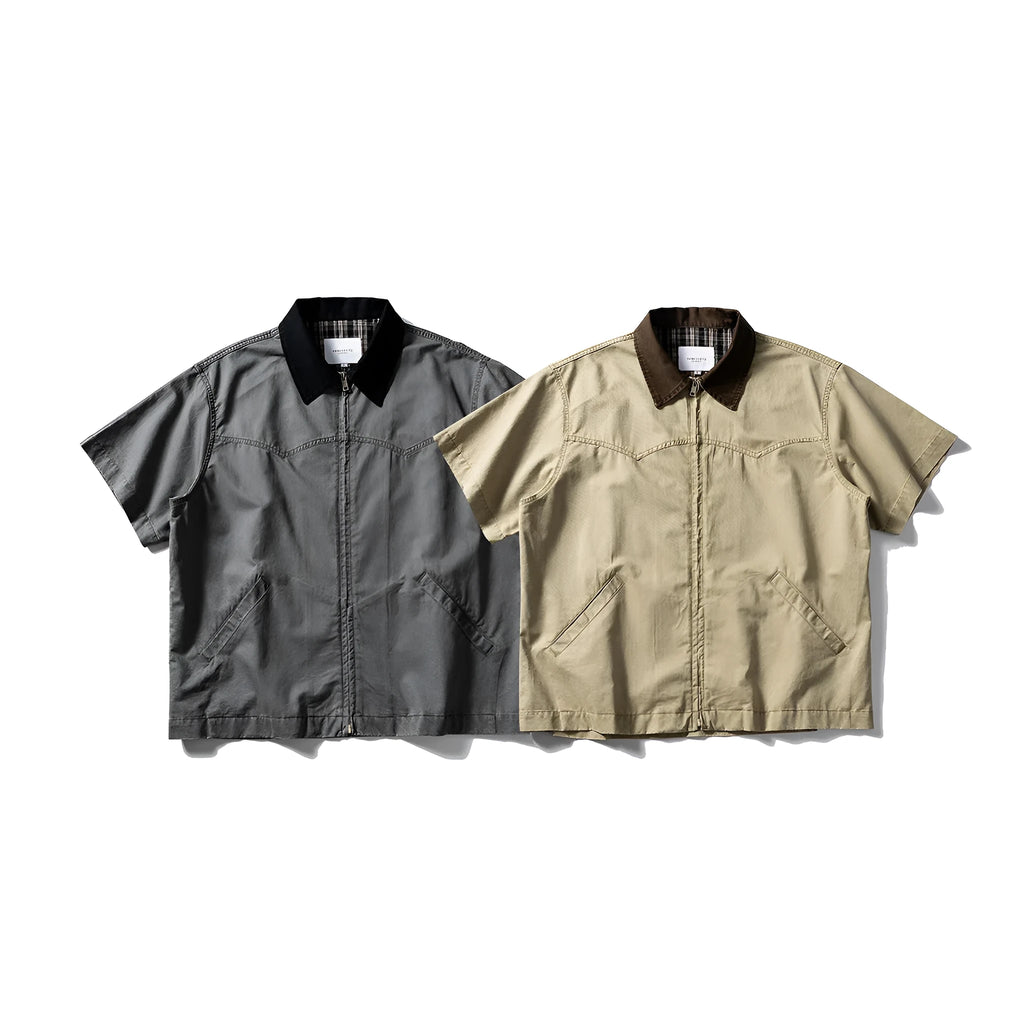 Man wearing a grey washed cotton short sleeve loose cardigan shirt.