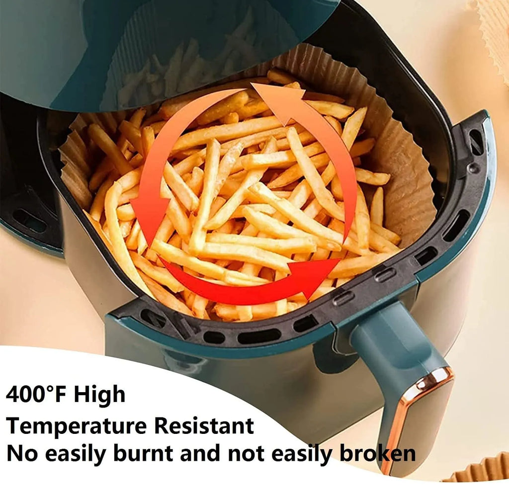 Round white disposable parchment paper liner for air fryer basket with raised edges.