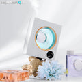 White wall mounted automatic aromatherapy sprayer with USB charging port.
