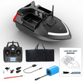 Black GPS remote control fishing boat with antenna and LED light on a calm lake.