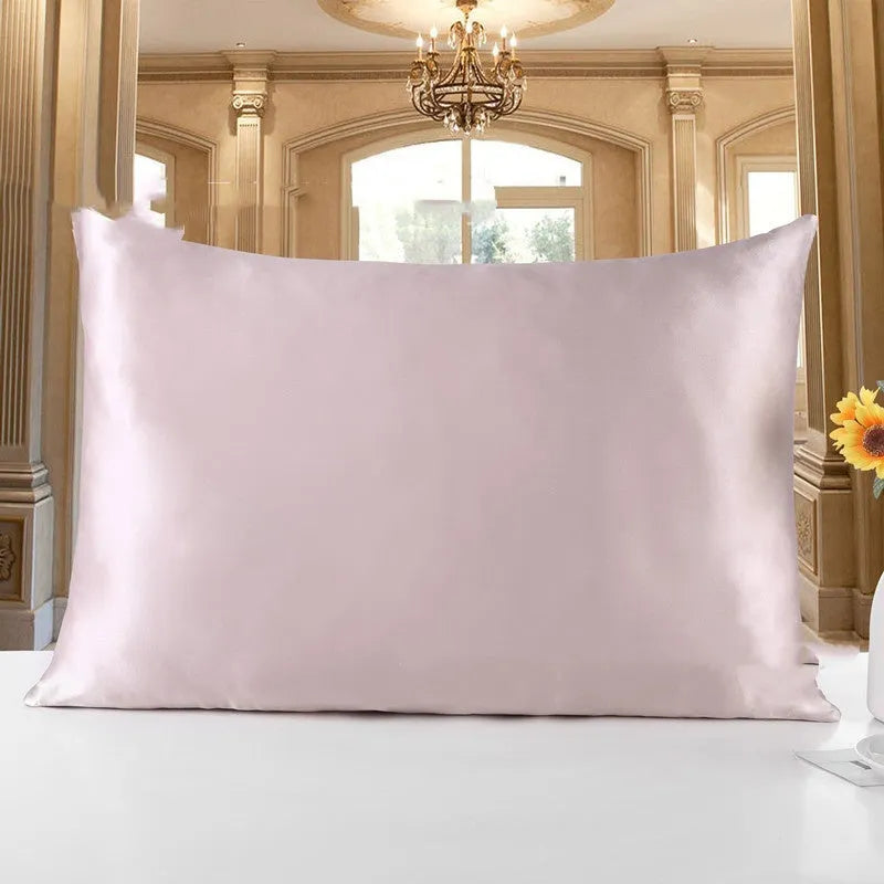 19 M double-sided silk pillowcase shown in one of 14 available colours, including apricot, sky blue, and black.