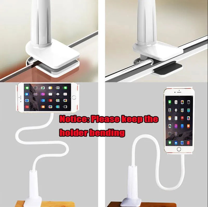 Black oversize bedside phone holder with a long adjustable arm mounted on a wooden table.