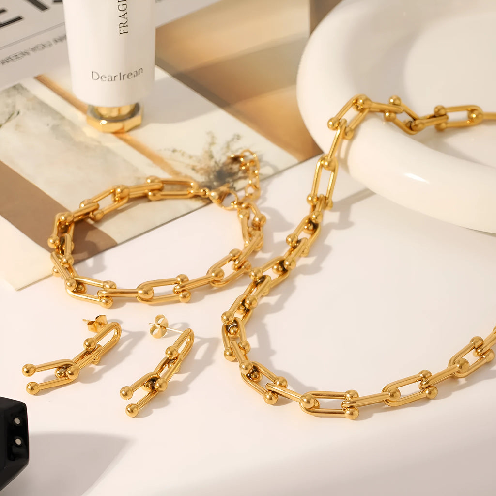Stainless steel horseshoe chain jewellery set with titanium steel pendant showing necklace, bracelet and earrings