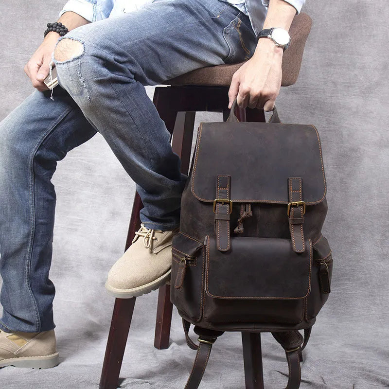 Retro brown leather backpack with double shoulder straps and vintage styling