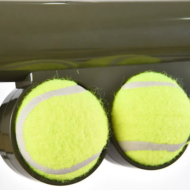 Black ABS tennis ball shooting gun for pets with two signature tennis balls