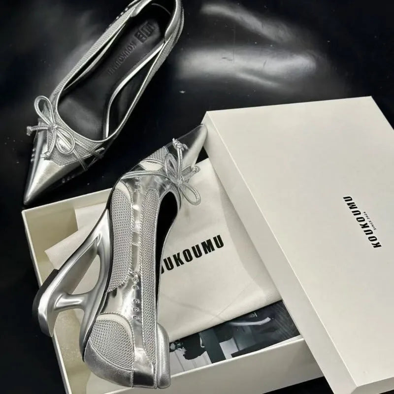 Black women's Mary Jane shoes with a pointed toe and a unique floating special-shaped heel.