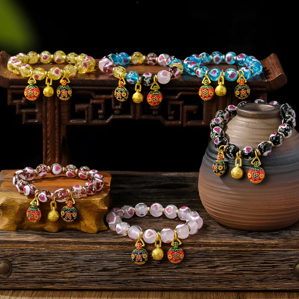 Handmade glass bracelet with swallow gold beast motifs and 10mm heart-shaped beads in multiple colour options