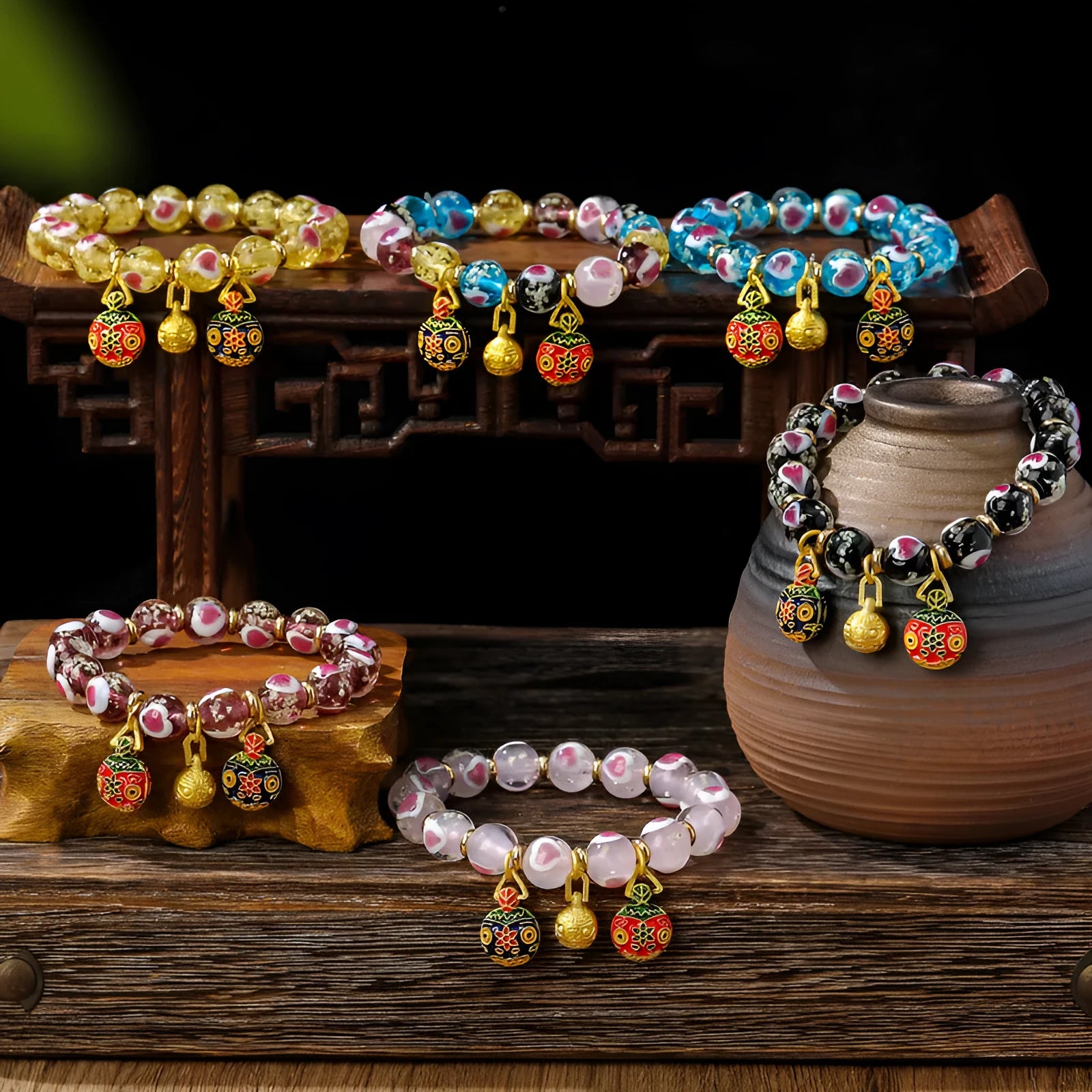 Handmade glass bracelet with swallow gold beast motifs and 10mm heart-shaped beads in multiple colour options