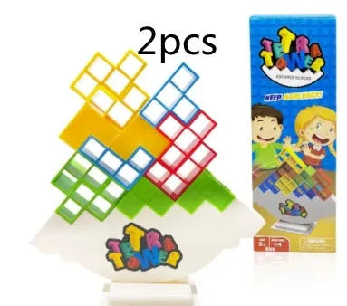 Plastic balance stacking game with colourful blocks, chassis, and base in packaging.