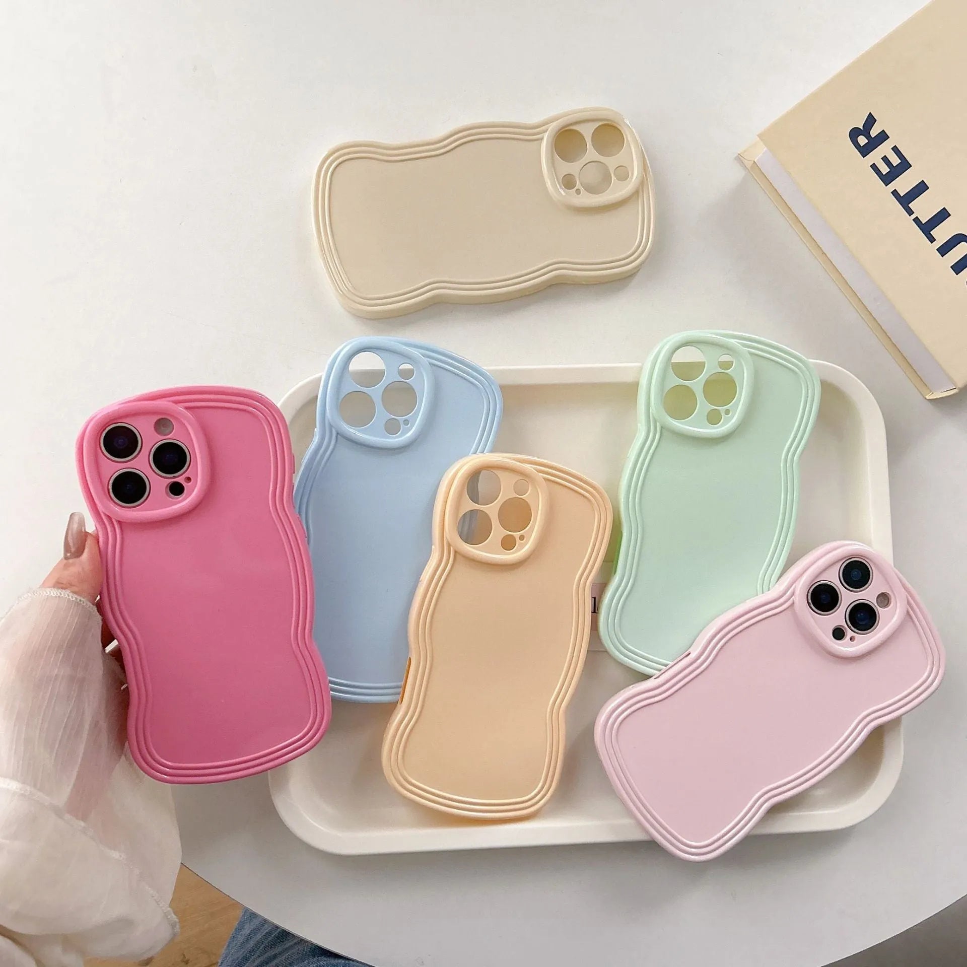 Cream candy colour wave design TPU case for iPhone on a white background.