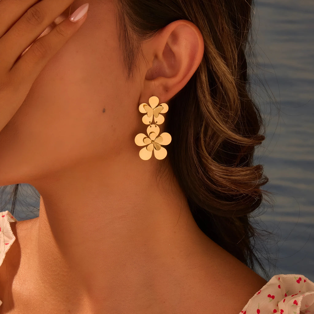 Gold-coloured stainless steel butterfly flower earrings with geometric and zodiac design elements