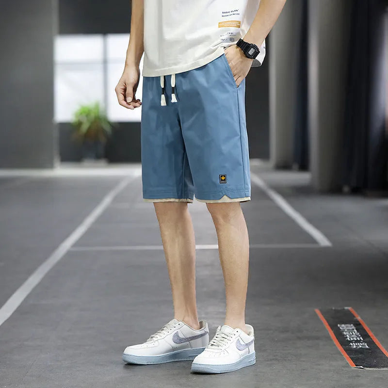 Casual loose-fit beach shorts in green with a straight cut and elasticated waistband