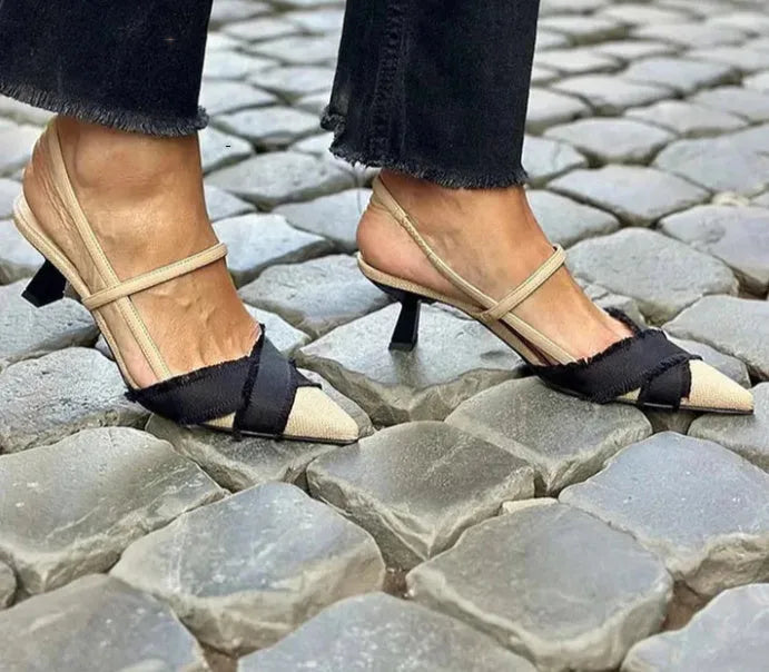 Apricot and black colour block women's stiletto sandals with a buckle strap and pointed toe.