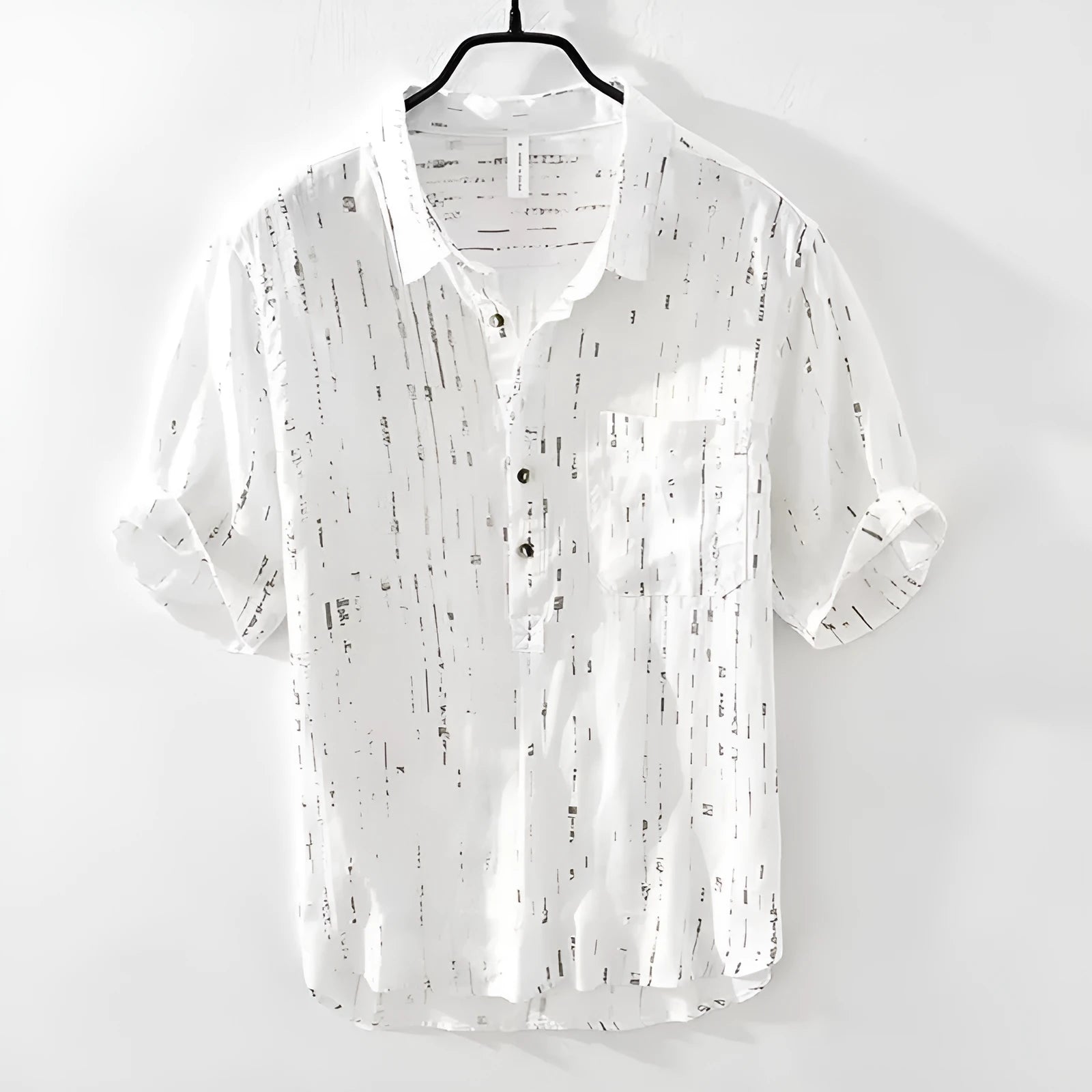 Men's loose fit short sleeve polo shirt in black, shown on a model.