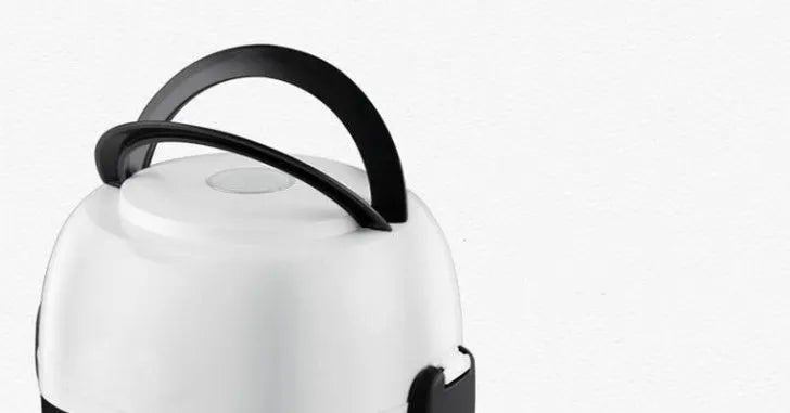 White rice cooker appliance with 2L capacity measurement indicators
