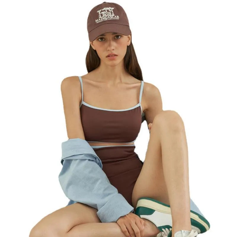 Brown women's one-piece swimsuit with triangle top design on a mannequin