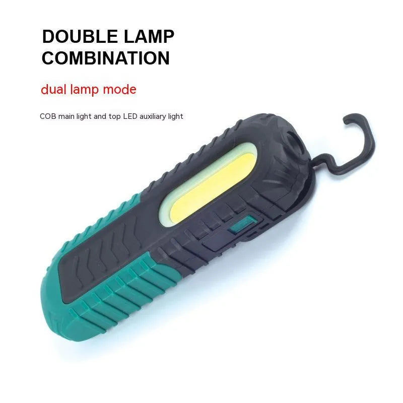Black and green USB-charged auto repair work light with compact design for vehicle maintenance