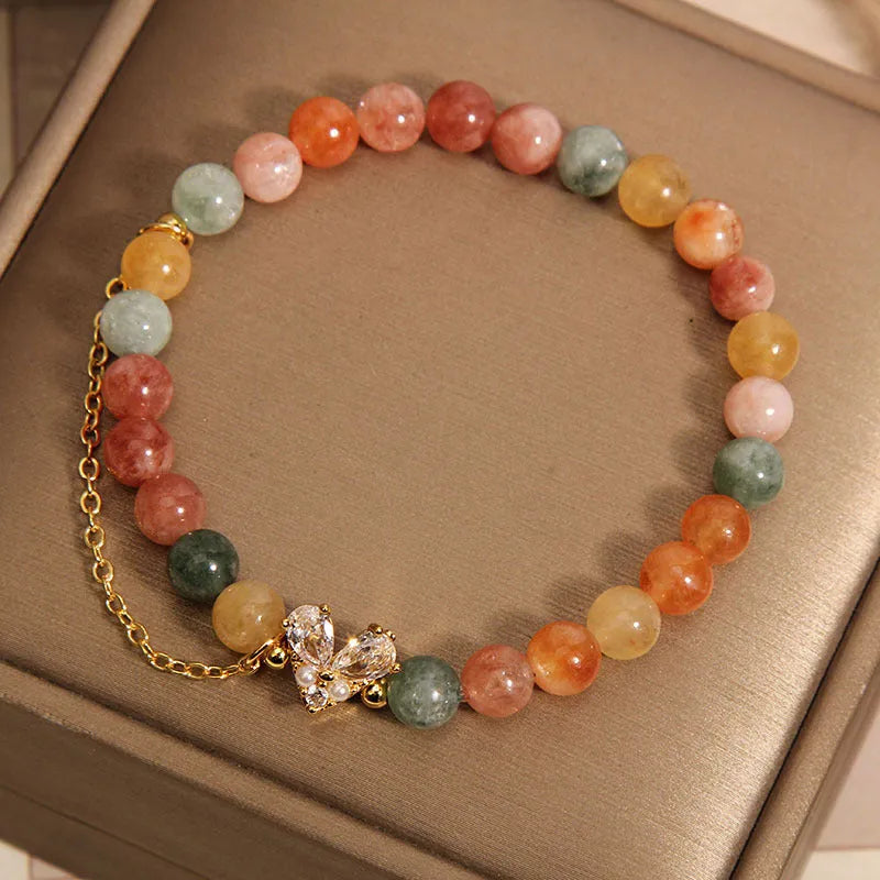 Fu Lu Shou crystal bracelet for women with gold tone metal settings and V-shaped zircon design