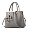 Retro fashion handbag in PU with zip opening and a one-shoulder strap.