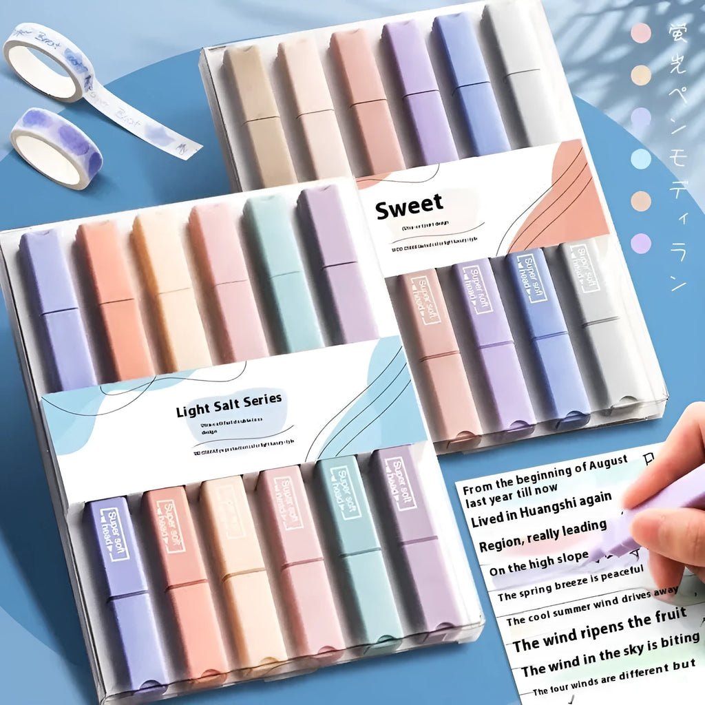 Set of six double-headed fluorescent highlighter pens with assorted barrel colours on a white surface.