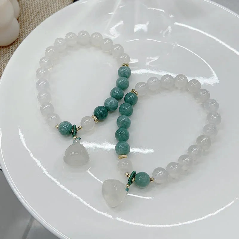 Women's retro Chinese style agate lotus seedpod bracelet with Burma jade accents on wrist