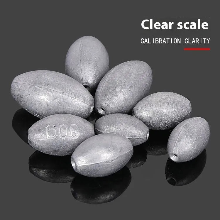 Tongxin olive lead fishing sinker with scale pattern and plastic core in rugby shape.