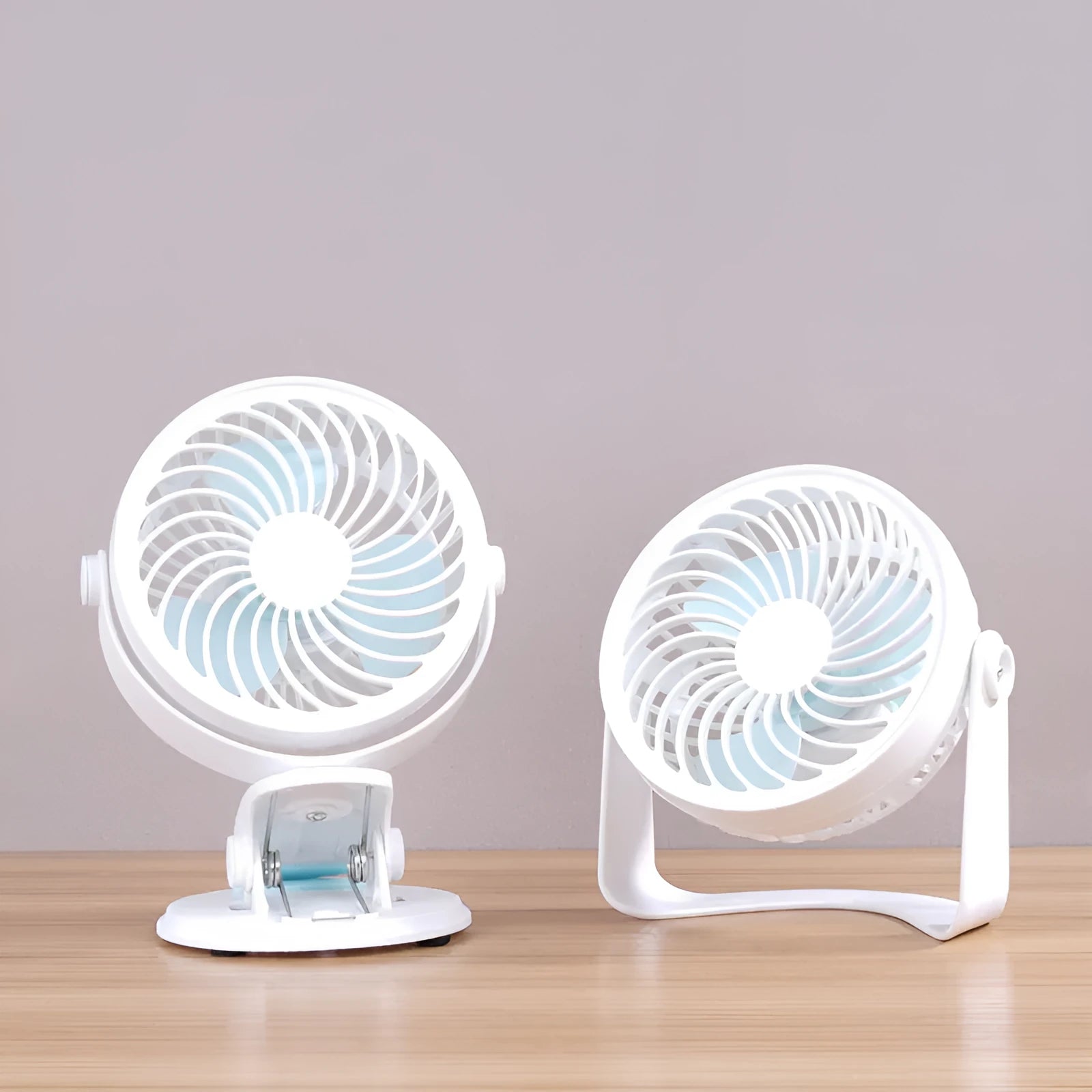Compact USB desk fan shown in both clip-on and mini floor standing styles on a wooden desk.