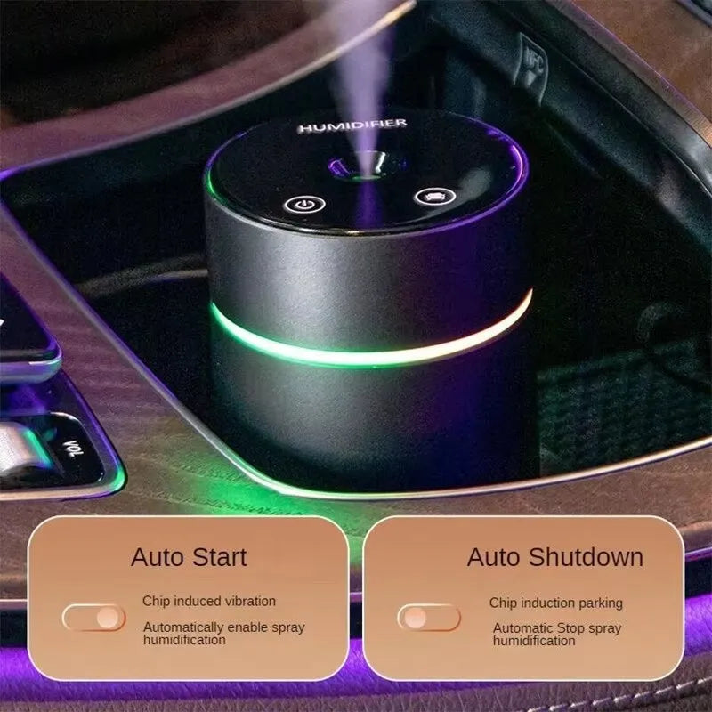 Black aluminium portable car humidifier diffuser with night light on a car dashboard