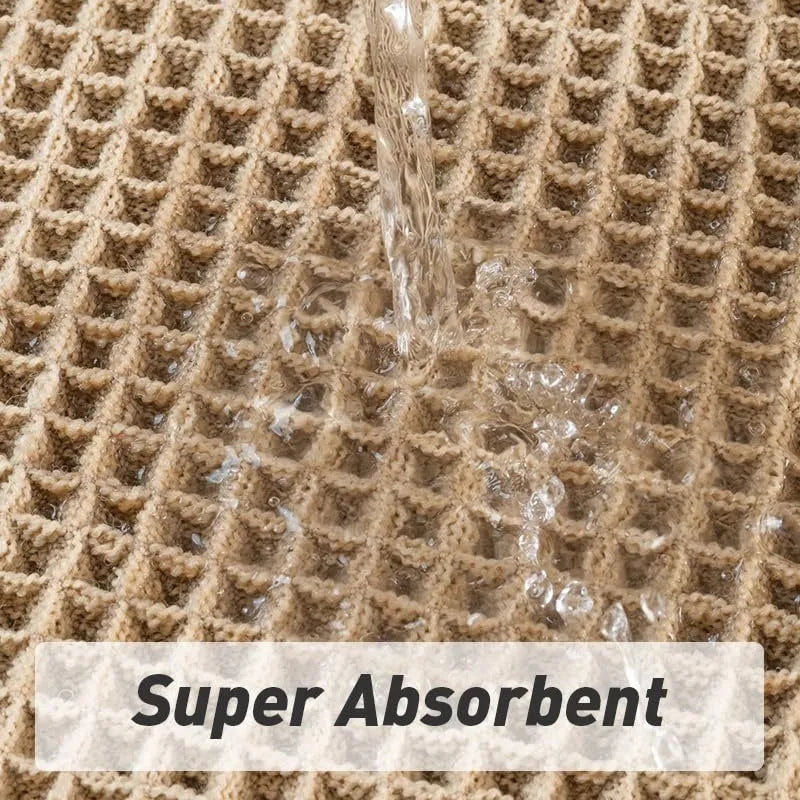 Checkered patterned absorbent bathroom carpet on floor showing non-slip woven base in beige colour.