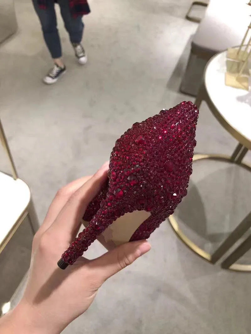 Women's gold stiletto heels with rhinestone decoration and pointed toe