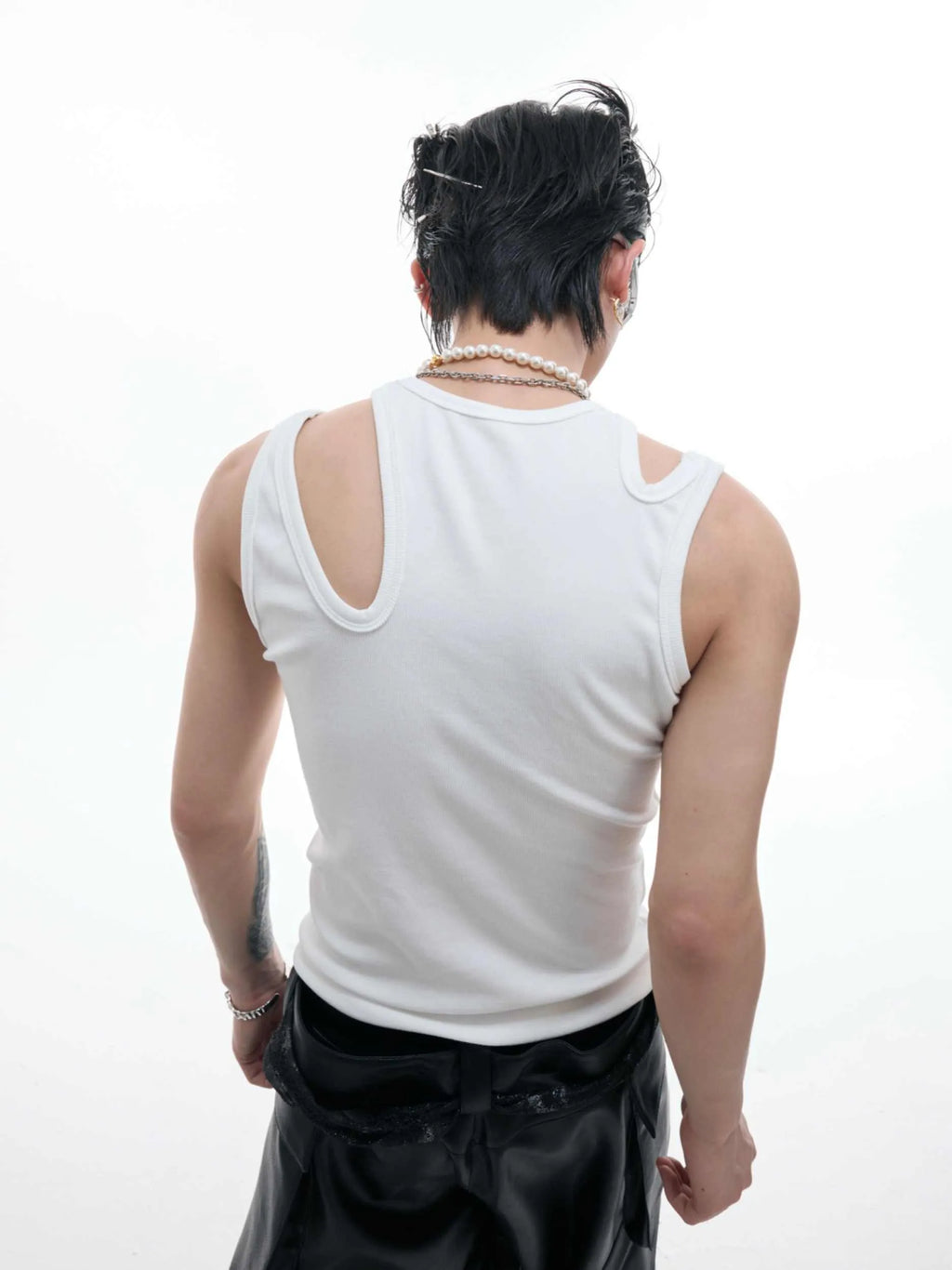 Retro crocheted hollow sleeveless polyester top with metal decoration in white, front view, slim fit