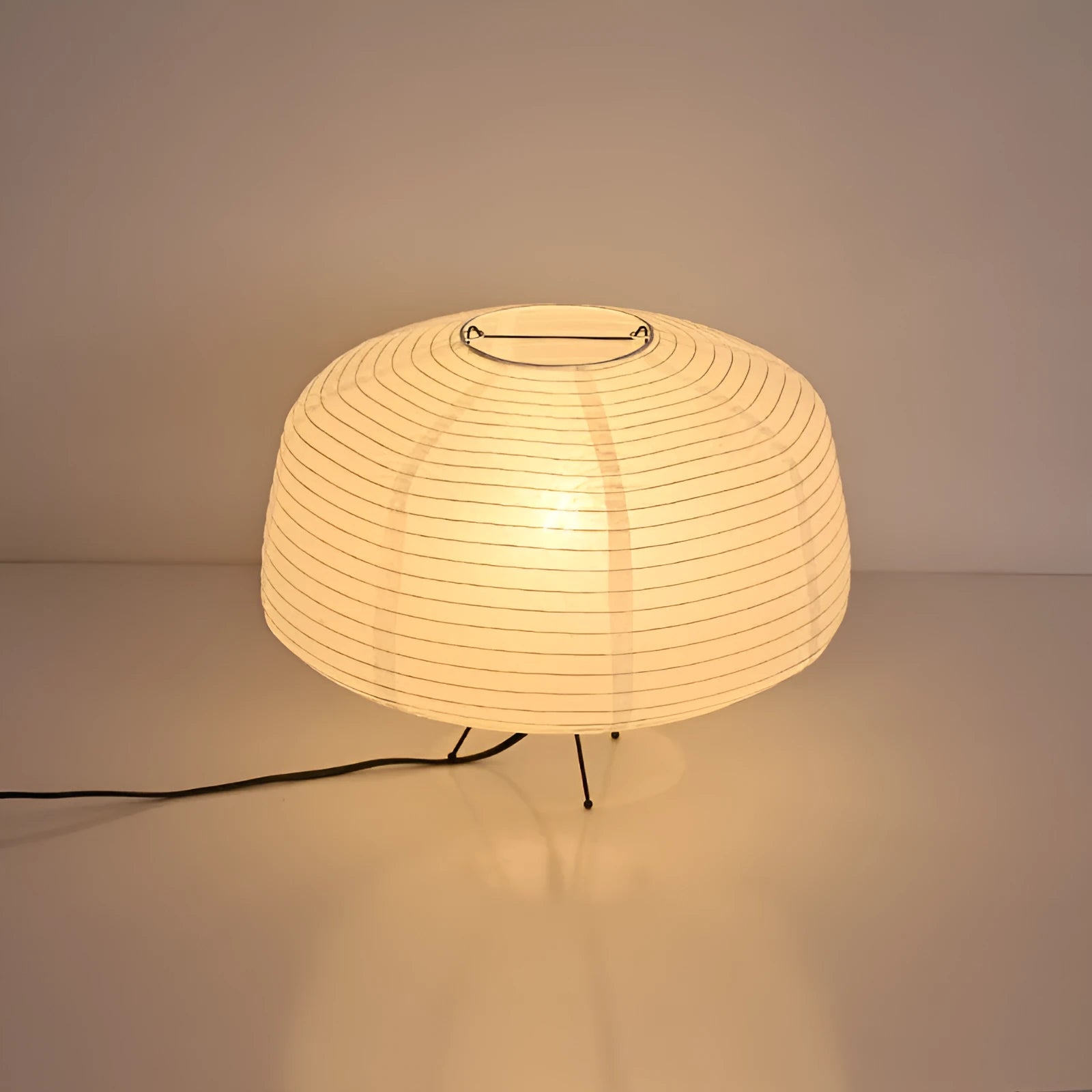 Japanese style xuan paper desk lamp with three-colour light source on a wooden desk in a bedroom