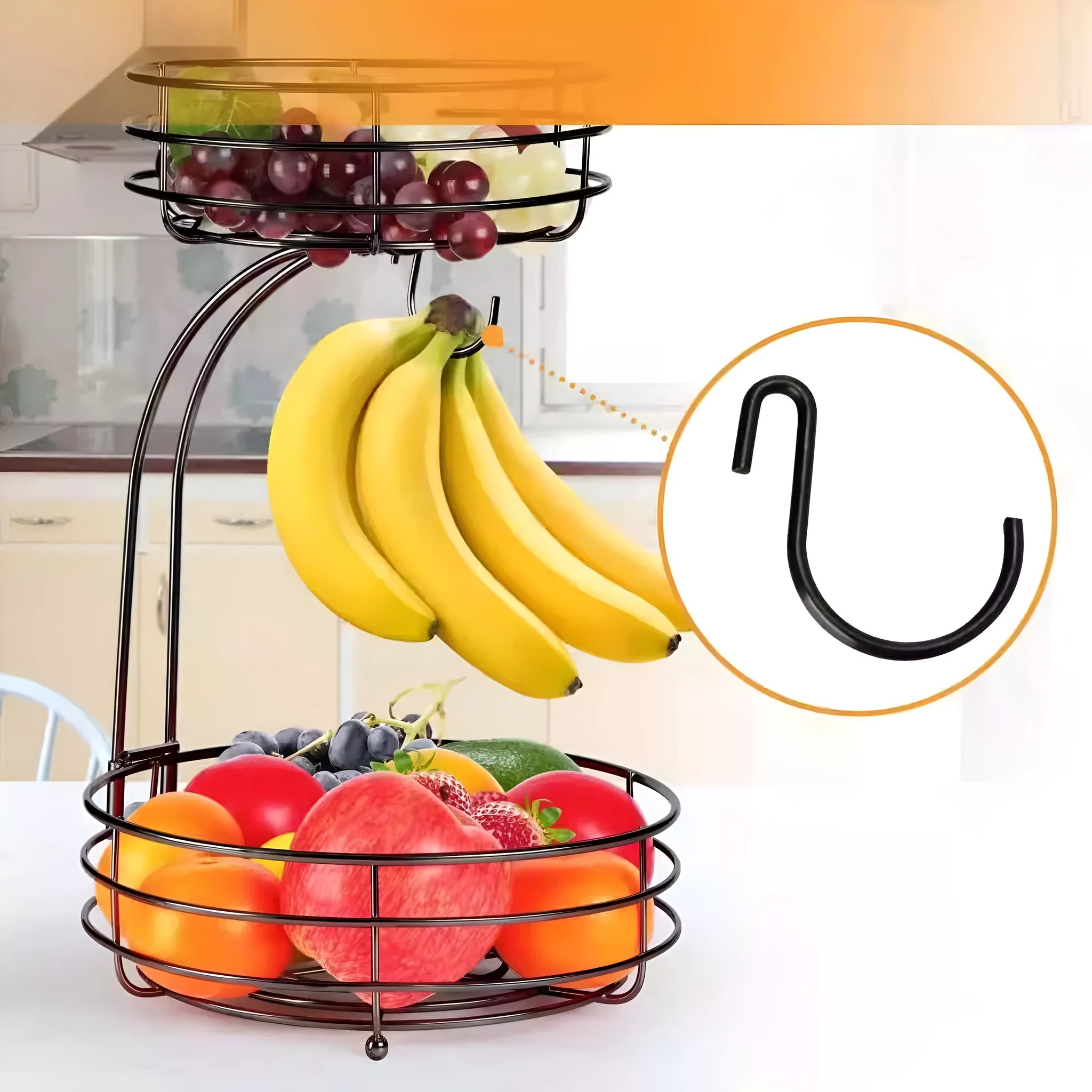 Black and gold two-tier wrought iron fruit storage basket with open metal framework.