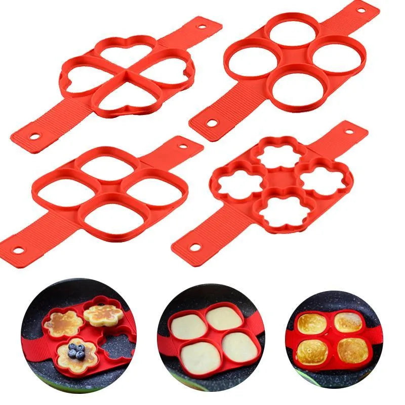 Red silicone non-stick egg ring mould for making round pancakes on a frying pan