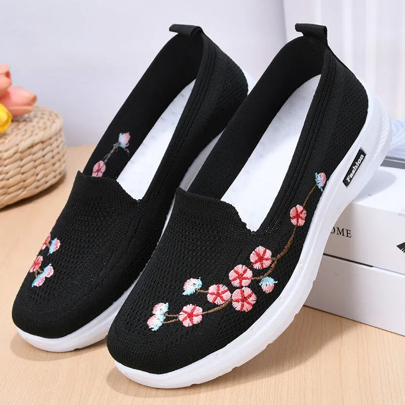 Women's wine red woven casual pumps with floral embroidery and a low anti-slip sole.