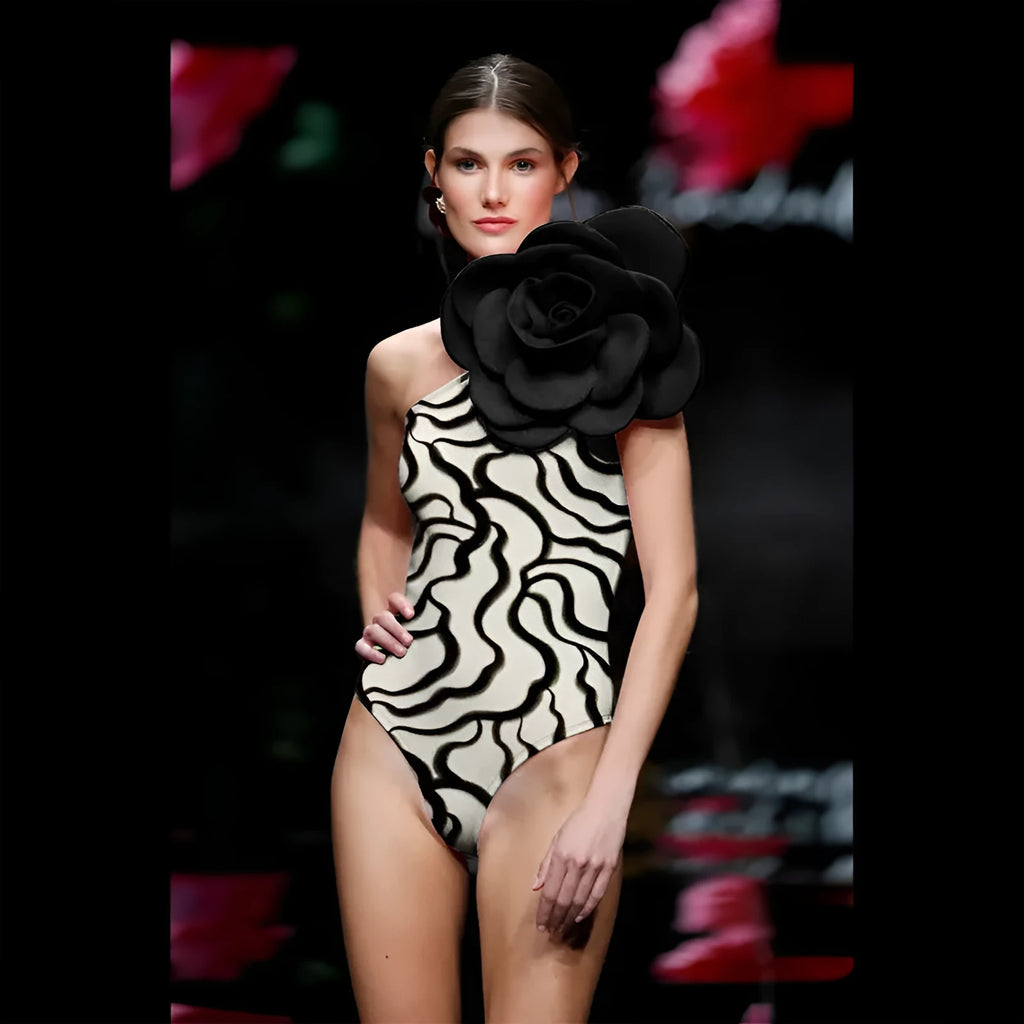 Women's solid colour one-piece swimsuit with three-dimensional flower design for swimming.