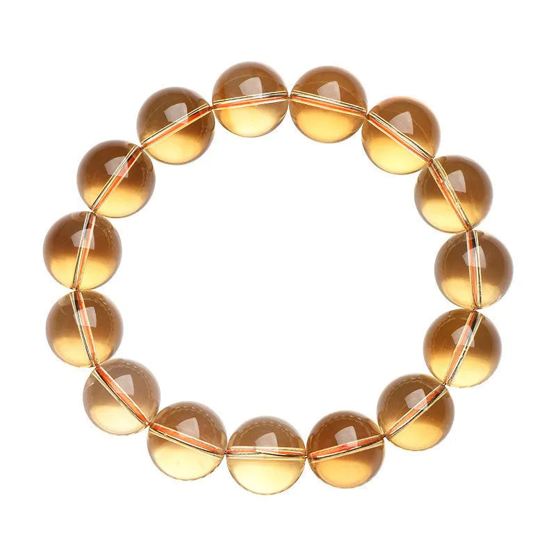 Natural citrine scattered beads ball bracelet on a wrist, showing polished stones in a choice of colours and sizes.