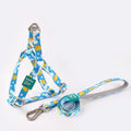 Blue polyester dog vest with attached haulage rope set on adjustable chest strap.