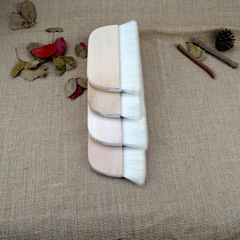 Wool brush for mounting diamond painting canvases, available in multiple sizes.