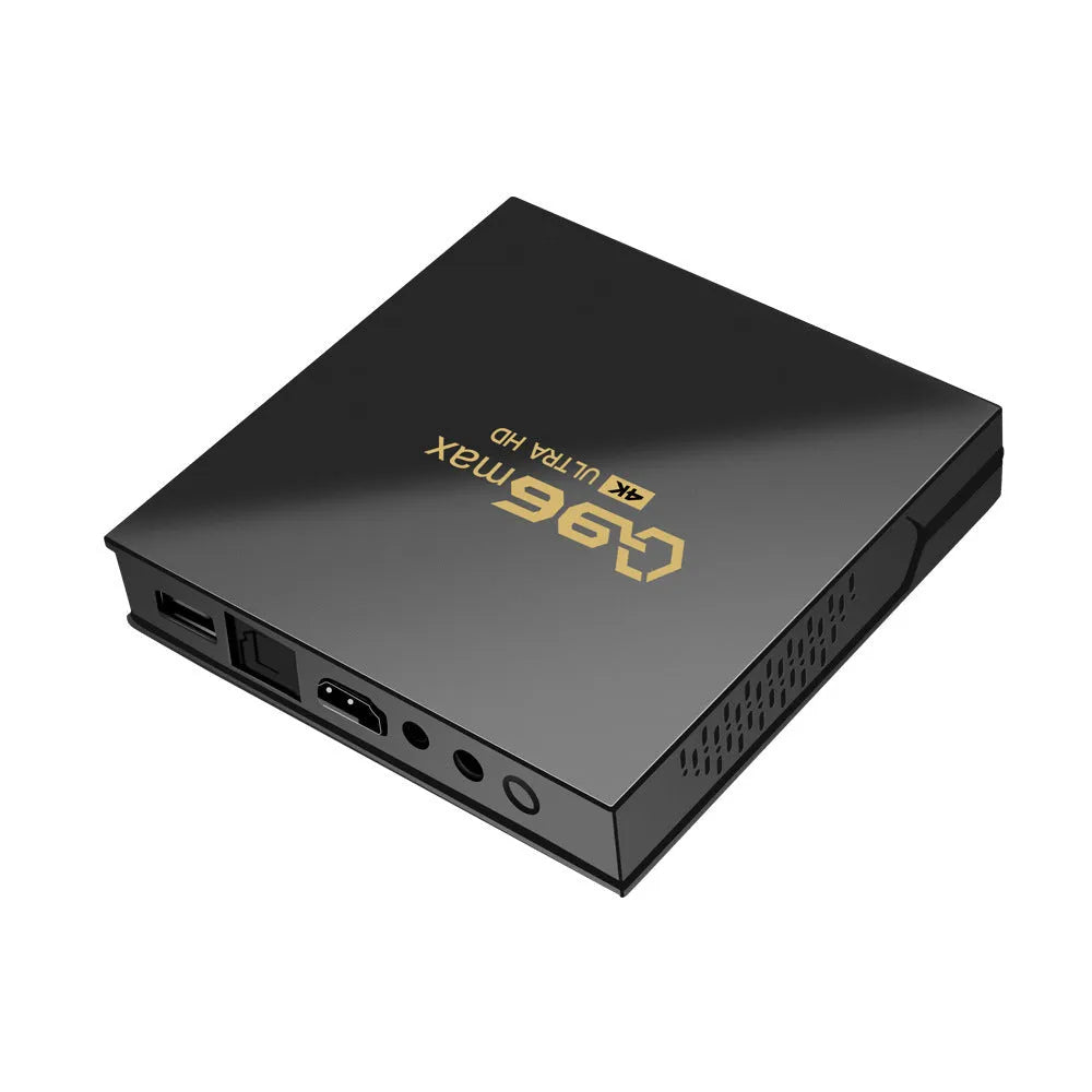 Q96 MAX S905 Android 4K TV Box set-top unit with remote control and cables on a black background.